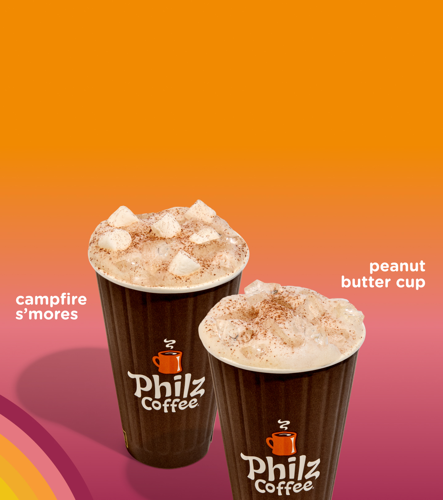 Two iced coffee beverages. One with marshmallows on top and one with a dusting of cocoa powder.